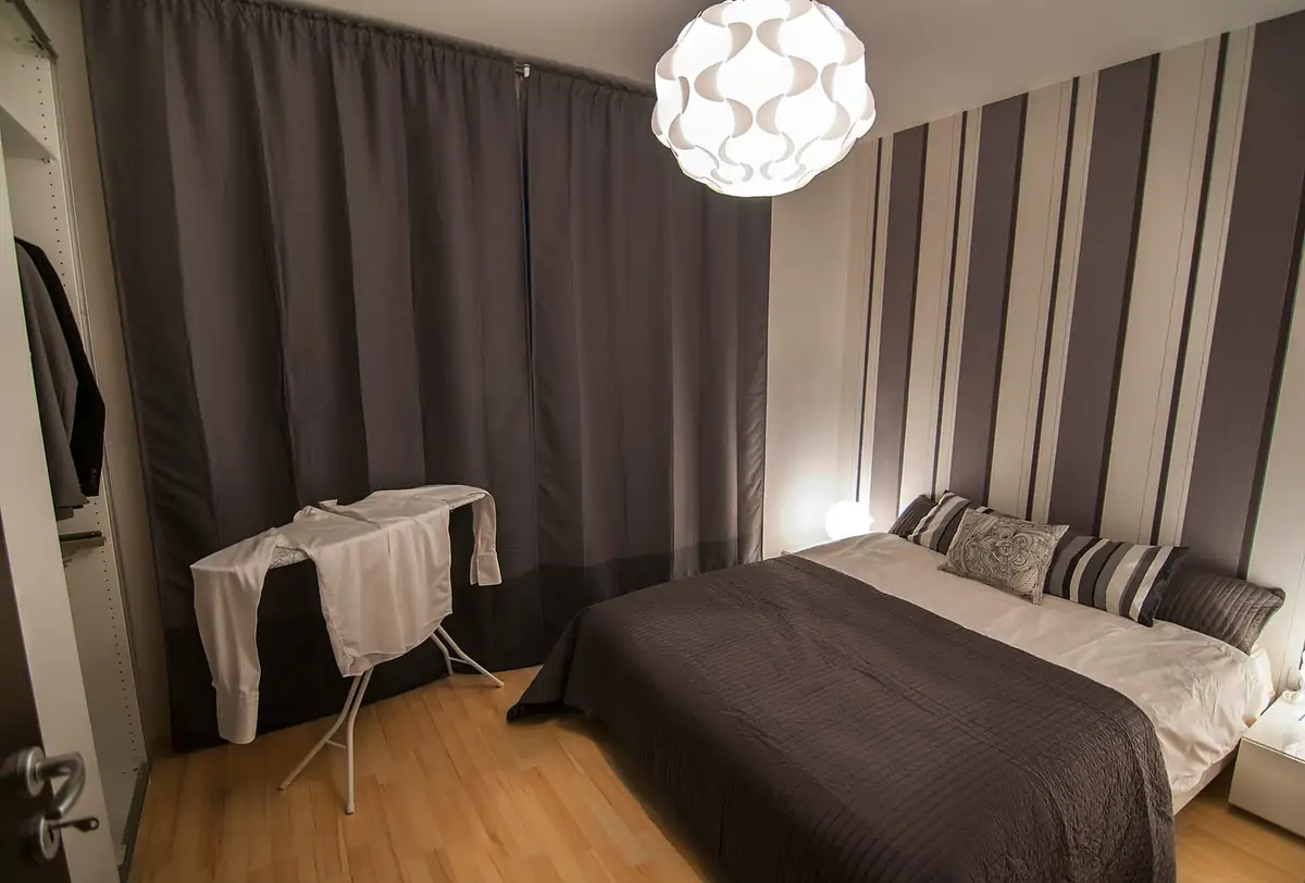 Made bed in a bedroom where fogger mist cannot reach seams